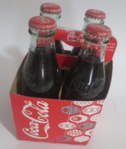 Coca-Cola 2008 Christmas 4 pack 8.5 Fl OZ Full Bottles - $10.40