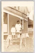 RPPC Cute Kids Standing On Saw Horse In Yard Posing For Photo Postcard P26 - £8.00 GBP