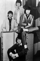 The Beatles The Fab Four sitting around luggage trunk 18x24 Poster - $23.99