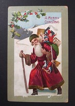 A Merry Christmas Santa in Green Hat Toys in Snow Embossed Postcard c1910s - $14.99