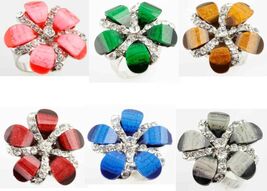 CZ FLOWERS IN BLOOM ADJUSTABLE STAINLESS STEEL RING - $3.20 CAD