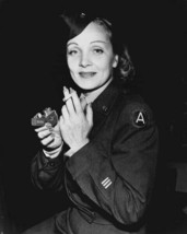 Marlene Dietrich smiling in military uniform lighting cigarette 8x10 inch photo - $10.99