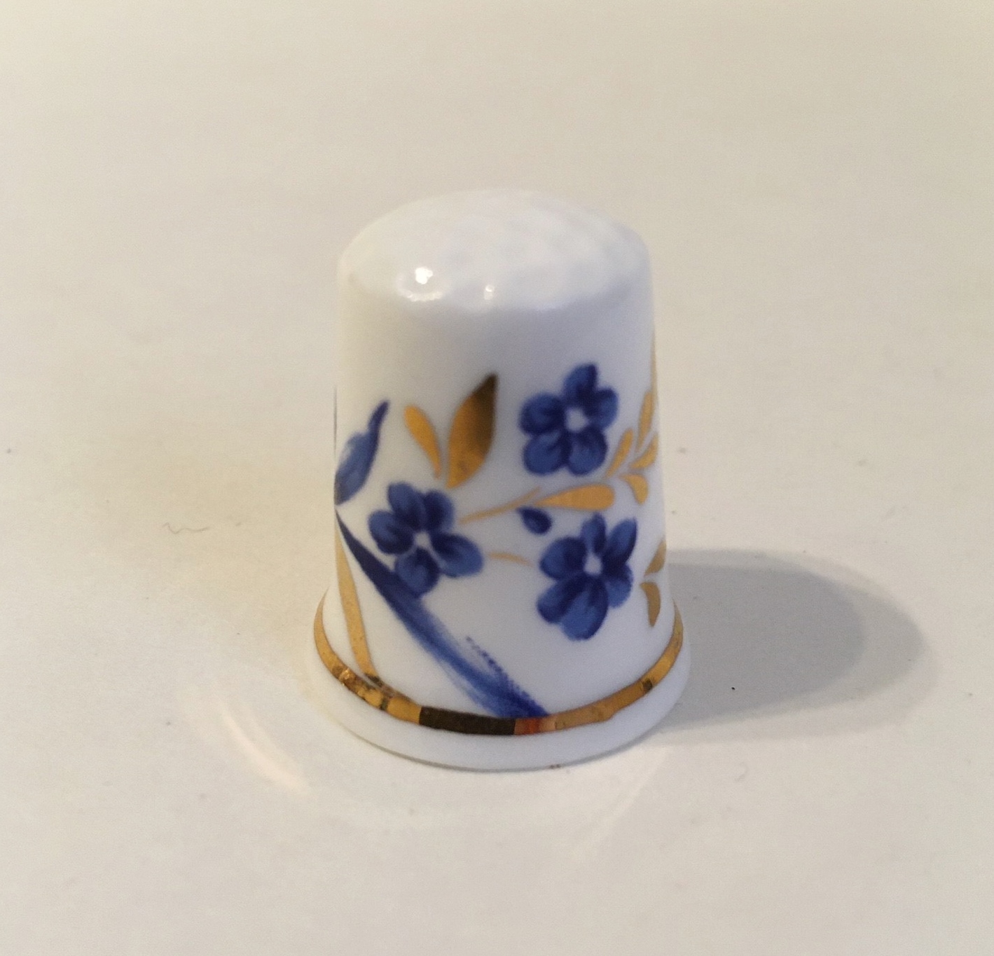 Primary image for Floral Thimble Fine Bone China England Gold Leaves Trim Blue Flowers Vintage
