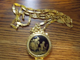 Vintage Golden Locket and Chain with black and gold old world motif on front - £20.94 GBP