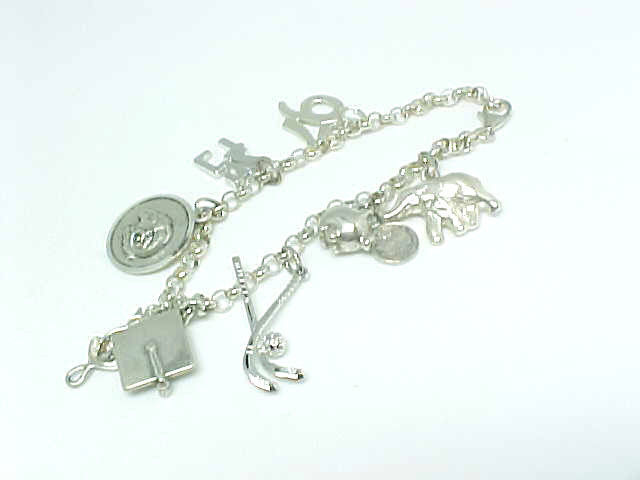 Vintage CHARM BRACELET in STERLING Silver with 8 STERLING CHARMS - 7 1/4 inches - $105.00