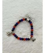 Orange, black, and purple glass bead bracelet with a spider, pumpkin, an... - $7.00