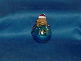 CHRISTMAS ORNAMENT Doggie sitting on a blue ball ornament with Noel signage - £3.88 GBP