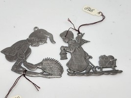 Set Of 2 Vintage Pewter Ornaments Boy With Porcupine Angel With Sled - £6.72 GBP