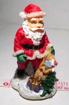 Santa Claus with bag of toys sparkling snow Christmas Figurine 1999 - $11.83