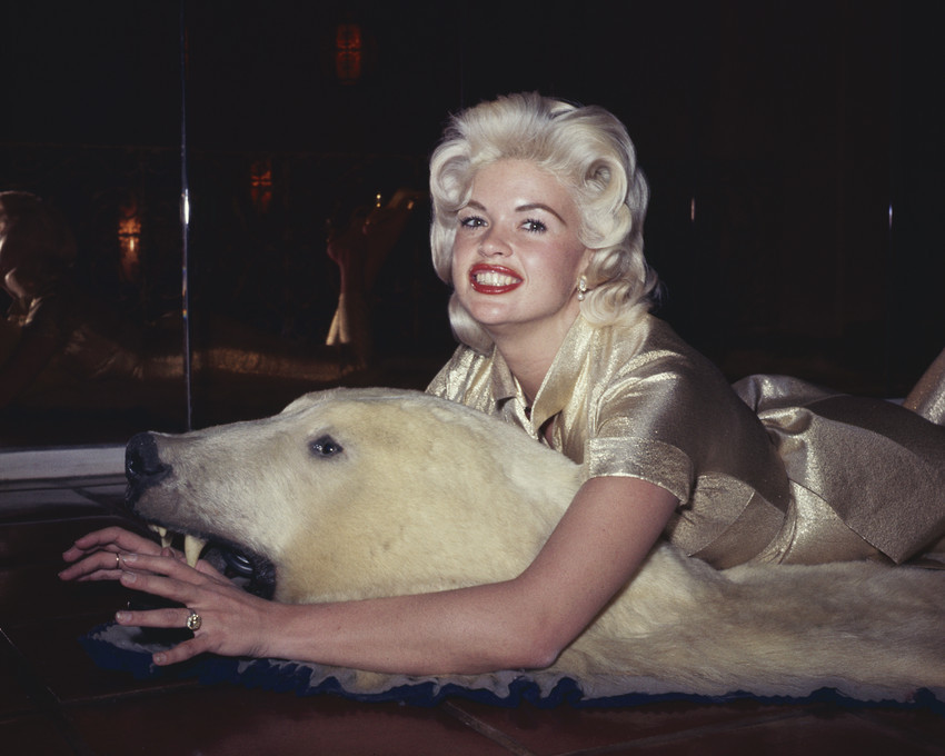 Jayne Mansfield in gold dress lying on bear skin rug 8x10 Photo