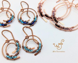 Handmade copper earrings: double spiral hoops wire wrapped with glass beads - £22.38 GBP+