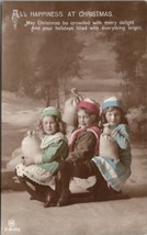 Christmas Happiness Children on Sled With Sacks Hand Colored RPPC Postcard W10 - £6.28 GBP