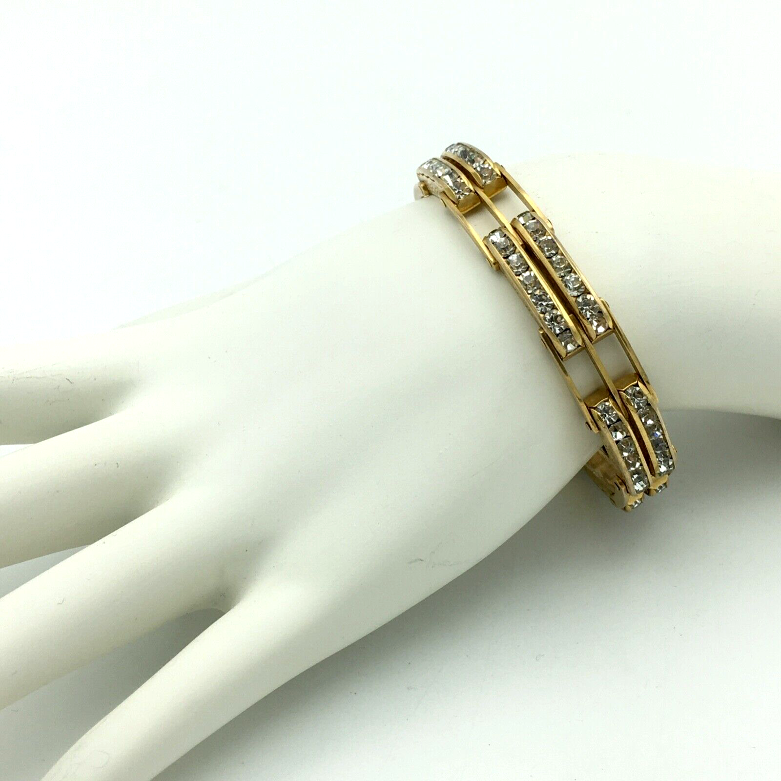 Primary image for ART DECO channel-set rhinestone bracelet - 7.75" gold-tone emboss riveted panels