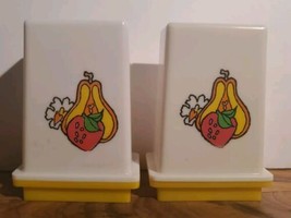 VINTAGE WHITE &amp; YELLOW WITH FRUIT ON FRONT CELLULOID SALT &amp; PEPPER SHAKE... - $13.85