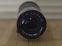 Lovely Canon FD 100-200mm f5.6 Zoom lens with built in lens hood and 1980 Olympi - $85.00
