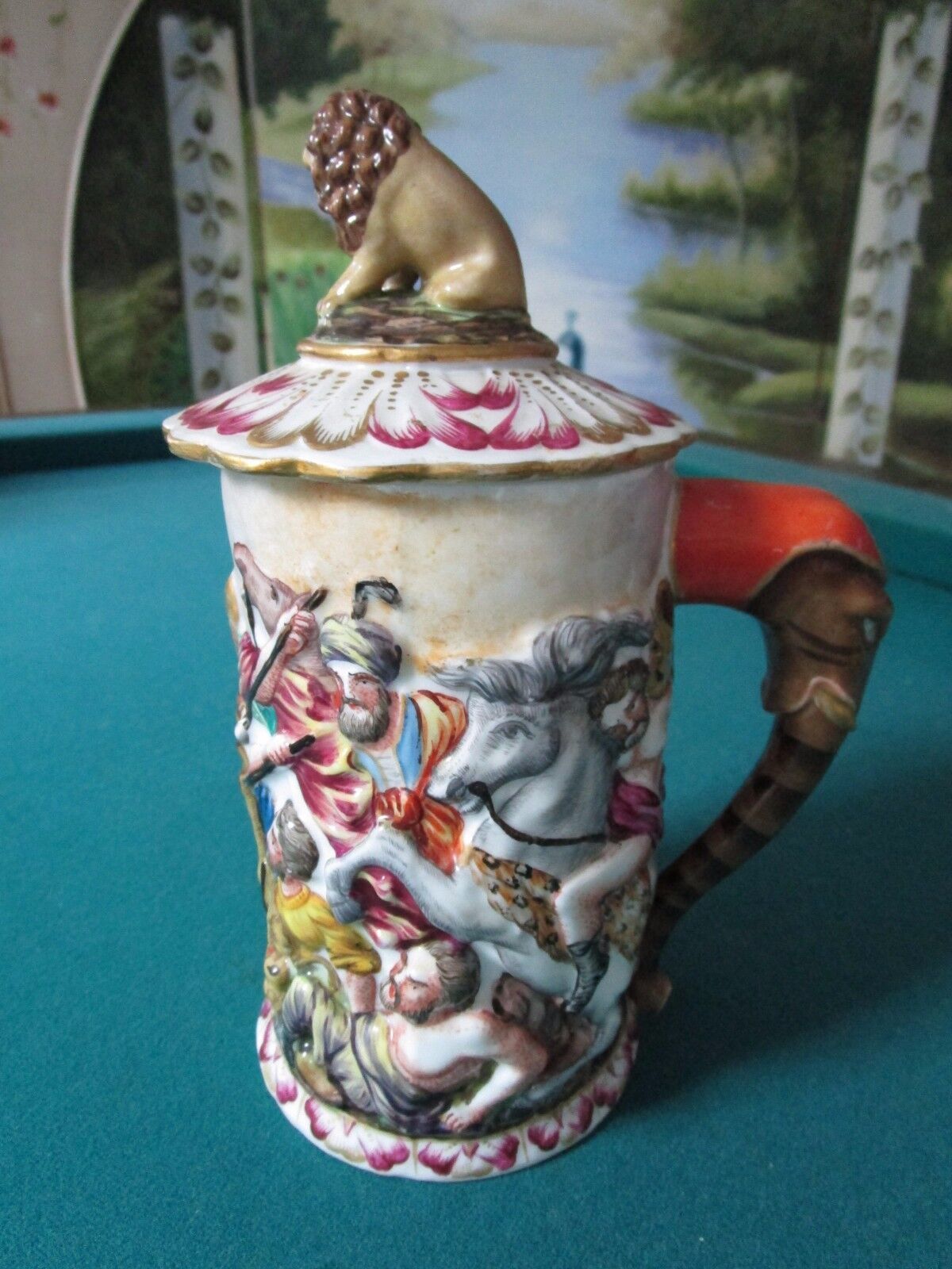 Primary image for CAPODIMONTE COVERED STEIN BATTLE AND LION FINIAL, ELEPHANT HANDLE [*B]