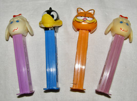 VINTAGE LOT OF 4 PEZ DISPENSERS - LAMB CHOP, DAFFY DUCK, GARFIELD, LAMB ... - $8.91
