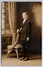 RPPC Edwardian Young Man With Wicker Chair Studio Photo Postcard G34 - $5.95