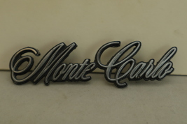 1973-1977 Chevrolet “Monte Carlo” Header Panel Script Emblem OEM 3252733303 - $10.58