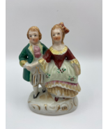 Vintage figurine of a couple holding hands, made in Japan - $17.88