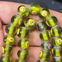 greenish tint small yellow smiley faces Venetian inspired Beads Strand - $874.50 MXN