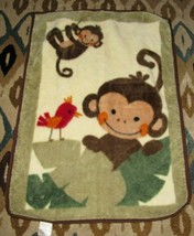 An item in the Baby category: Lambs & Ivy Brown Monkey Red Bird Plush Baby Blanket Leaves
