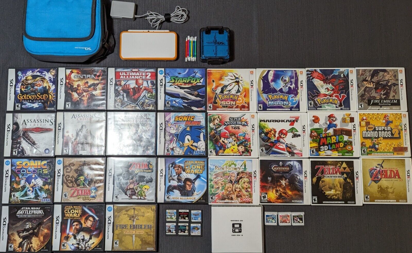Primary image for New Nintendo 2DS XL (JAN-001) White and Orange w/ Games and Travel Case