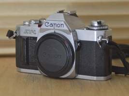 Canon AV1 SLR camera (body only) with very useful strap. These are perfect for b - £98.36 GBP