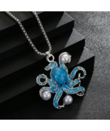 Chunky blue pearl  octopus pendant - $261.61 MXN
