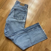 Signature Levis Jeans Mens Blue Relaxed Fit Denim 38x32 Distressed - $9.90
