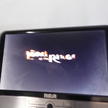 RCA DRC6296 Black 9 Inch Twin Screen Portable Mobile DVD Player With Acc... - $418.31 MXN