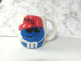 M&amp;Ms Candy Coffee Mug Blue M&amp;M &quot;Player&quot; Baseball Hat by Galerie Blue M&amp;M Mug - £11.19 GBP