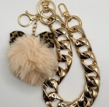 Chunky gold chain link bag strap with fuzzy beige pom pom with bow detail - $30.34