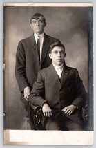 RPPC Two Handsome Young Men Unique Hair Seated Photo Postcard Y24 - £11.73 GBP