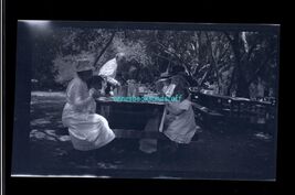 black and white negative - lunch outside? people sitting at picnic table - $8.95