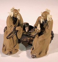 Ceramic Figurine Two Mud Men Sitting On A Bench with Musical Instrument ... - £6.21 GBP