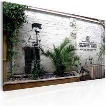 Tiptophomedecor Stretched Canvas Street Art - Banksy: Graffiti Area With Plants  - $79.99+
