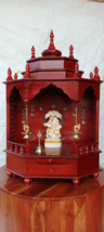 The temple is made of wood and brown color. It has 1 drawers, 1 puja shelf - $322.73+