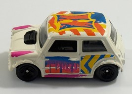 HOT WHEELS MORRIS MINI WHITE 1:64 DIECAST 2 1/4&quot; CAR W/ ORANGE BLUE &amp; PI... - $80.92 MXN