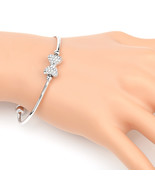 Silver Tone Bangle Bracelet With Sparkling Crystal Bow - $38.26 CAD