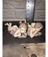 2 Vtg Porcelain Cherubs Angel Laying Foot Up  Figurines Hand Painted In ... - $67.68 CAD