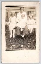 RPPC Sweet Mother With Three Children Girl With Wicked Smile Postcard K25 - £7.82 GBP