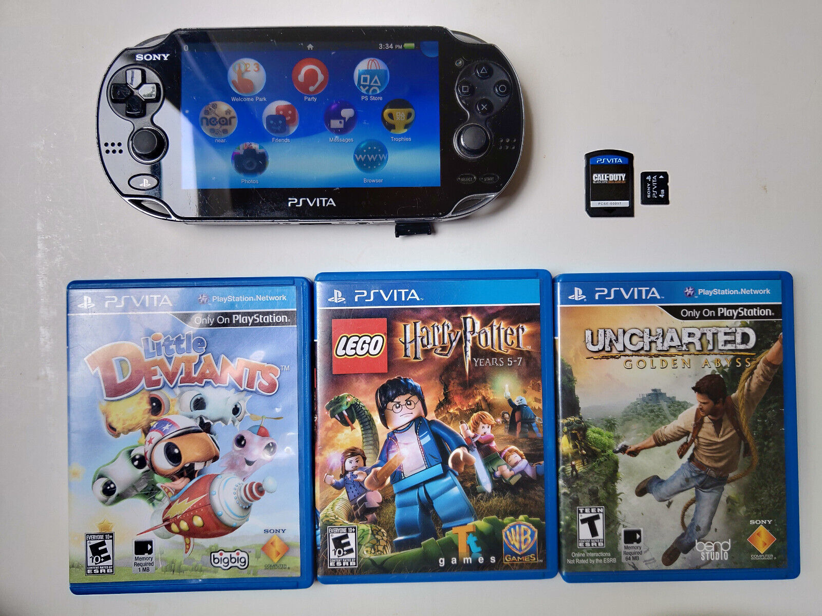 Primary image for Sony PS Vita PCH-1001 Handheld Console w/ 4 Games COD Uncharted  Firmware 3.73