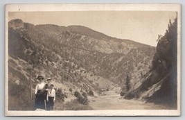 RPPC Mother And Sons Pose For Photo Along River Mountain Landscape Postcard S28 - £8.00 GBP