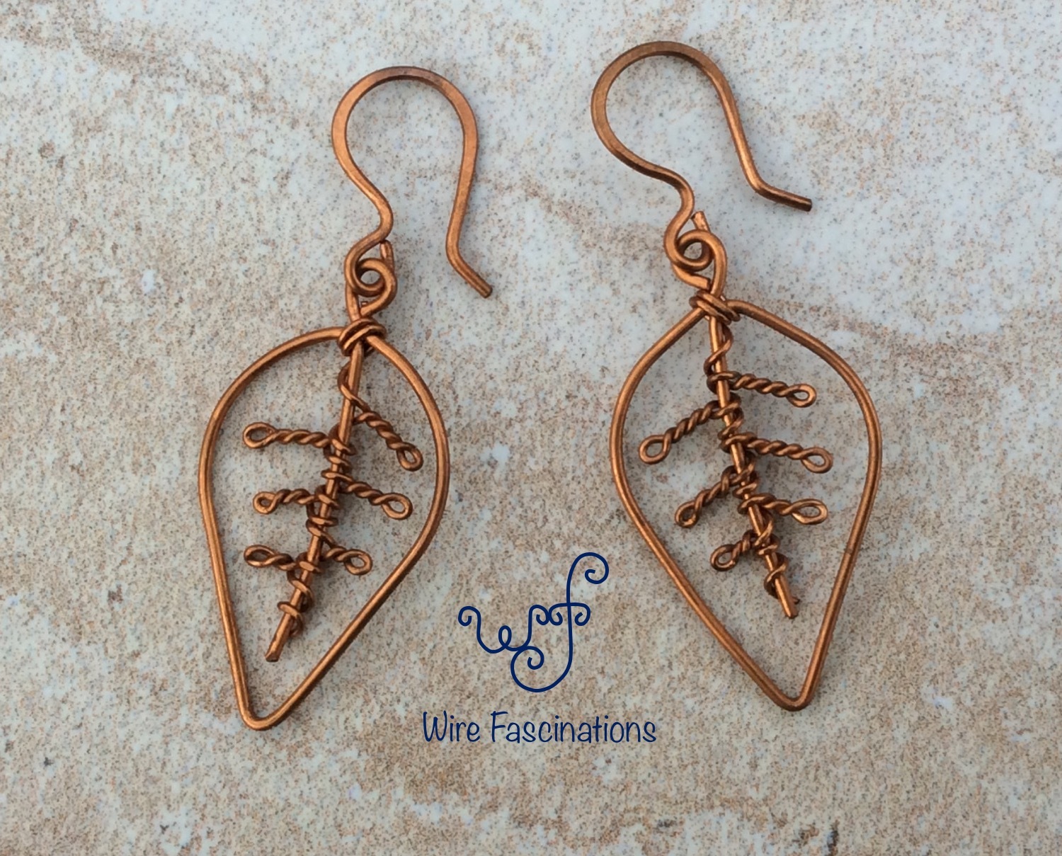 Handmade copper earrings: leaf with coiled veins - £15.98 GBP