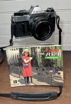 Canon AE-1 Program 35mm film SLR with Canon FD 50mm f/1.8 lens **NEW Bat... - $189.95