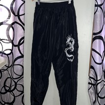 Women’s pull on styled pants with imported dragon size large - $11.76