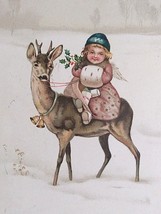 A Happy Christmas Girl with Muff Riding a Deer Angel Bells Holly Postcard c1910s - £23.68 GBP