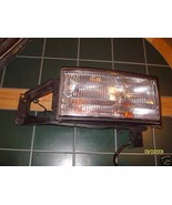 1996 SEDAN DEVILLE RIGHT HEADLIGHT WITH BRACKET OEM USED CADILLAC 1995 - $151.46