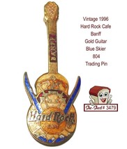 Hard Rock Cafe 1996 Banff Gold Guitar Skier with blue skis Trading Pin - $14.95